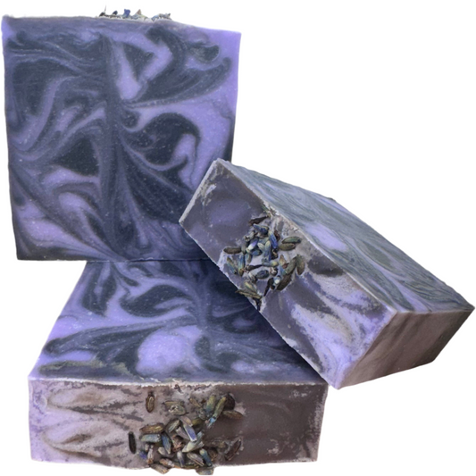 Three bars of purple and gray soap with leafy textures on a white background